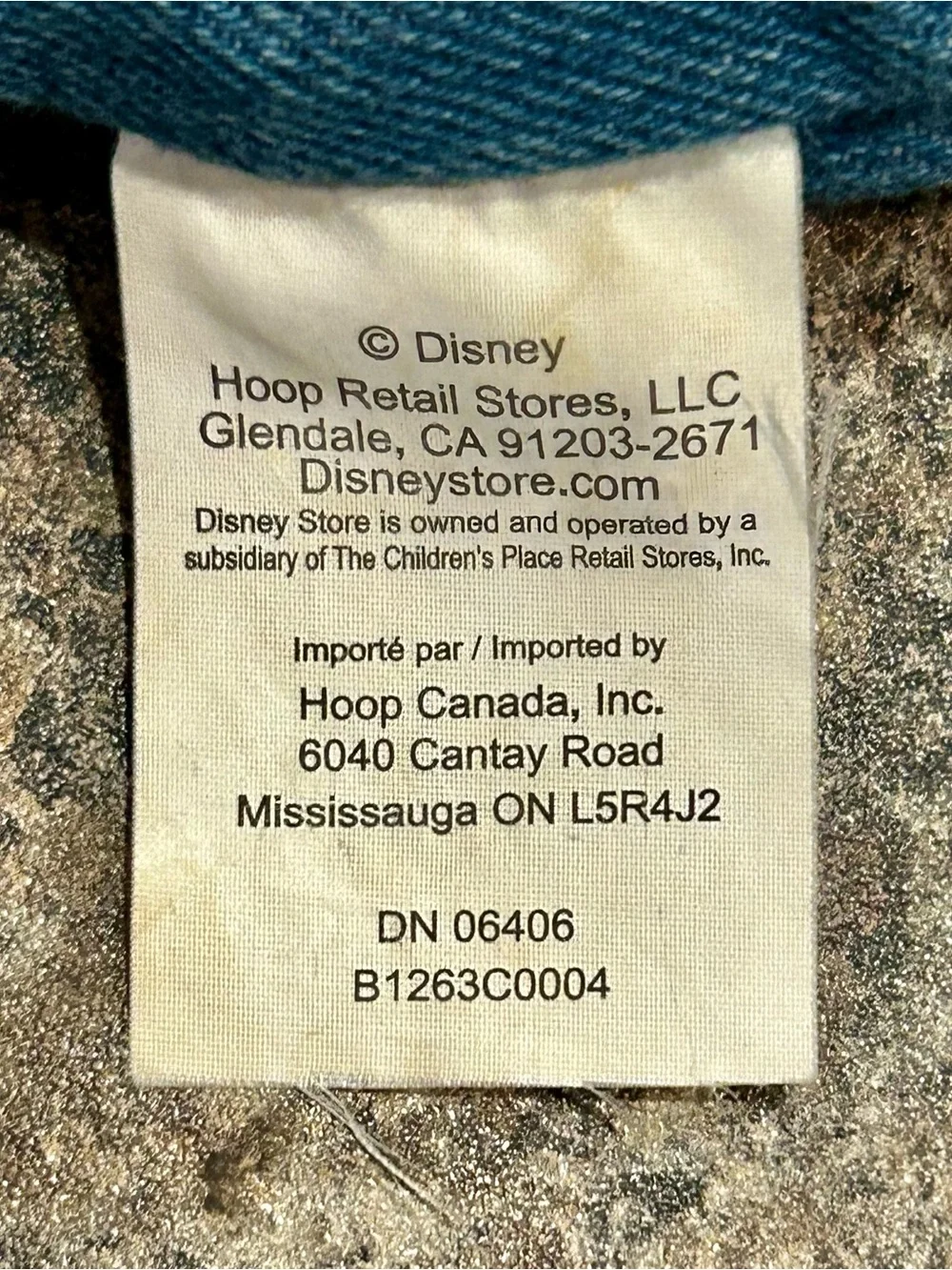 Disney White Fabric Care Tag with Blue Plush Edge